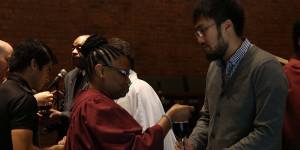Wesley students administering and taking communion
