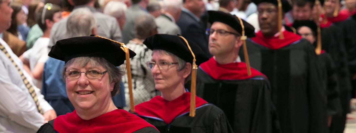 Commencement page banner photo of Doctor of Ministry students processing at commencement
