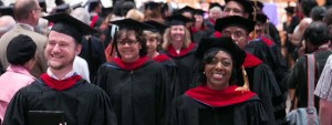 Image: group of smiling graduates at convocation