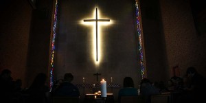 Cross in Oxnam Chapel on Wesley's campus during a Taize Service