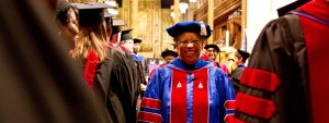 Joyful graduate at Wesley Theological Seminary: A beaming smile, a symbol of pride and the promise of transformative ministry