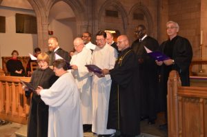 image of robed graduates of the Course of Study School singing at their graduation ceremonies