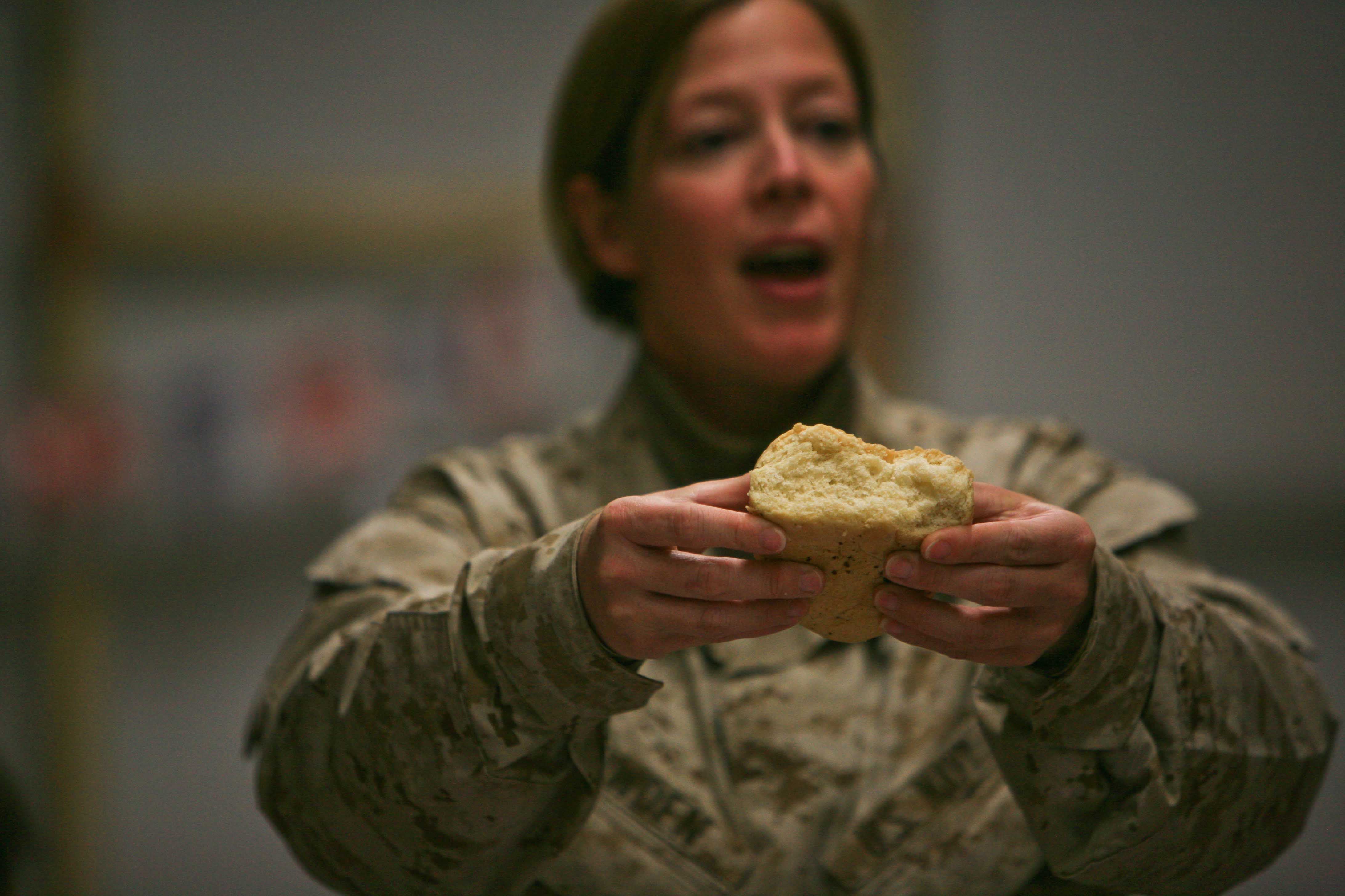 U.S. Navy Lt. Jennifer Bowder, a chaplain with Marine Wing Support Squadron 273, conducts a Christmas service for U.S. Marines and Soldiers at Combat Post Heider in Rabiah, Iraq, Dec. 29, 2008. (U.S. Marine Corps photo by Sgt. Jason W. Fudge/Released)